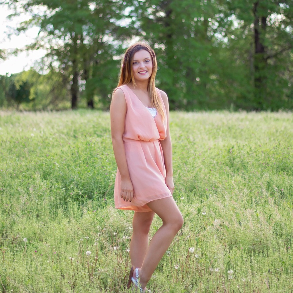 Peach color romper.